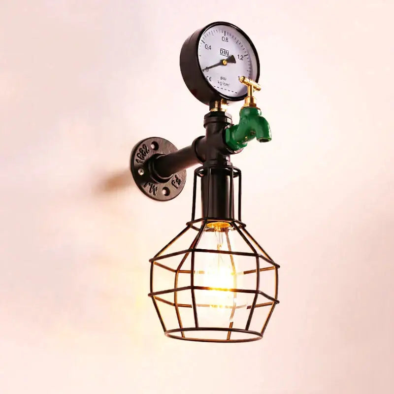 Industrial retro wall light with black metal pipe, green faucet, pressure gauge, and geometric wire cage bulb decorbites wall light