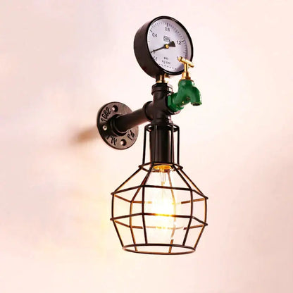 Industrial retro wall light with black metal pipe, green faucet, pressure gauge, and geometric wire cage bulb decorbites wall light