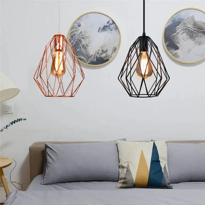 Two geometric metal cage pendant lights in rose gold and black iron metal cage for dining room decorbites iron metal
