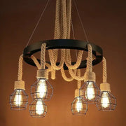 Industrial rustic pendant lights with black metal ring, beige rope suspension, and wire cage Edison bulbs for dining room decorbites