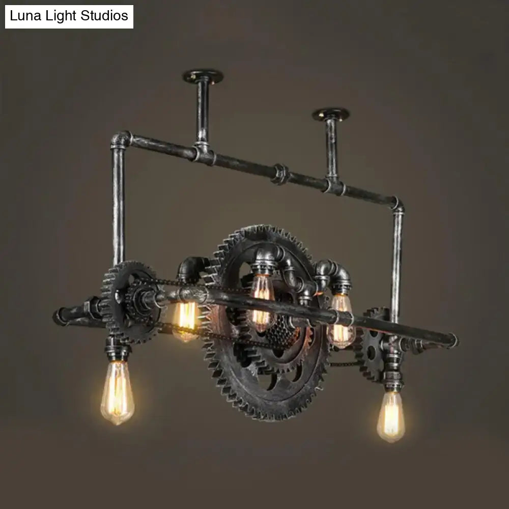 Industrial silver gray gear island pendant featuring black metal chandelier with exposed gears and vintage led bulbs for kitchen lighting
