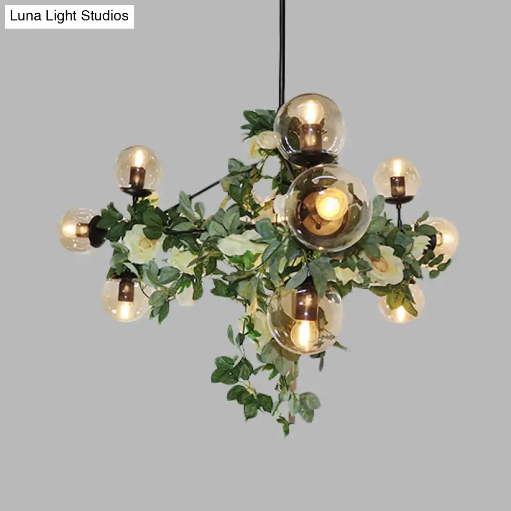 Decorbites industrial globe smoke gray glass island pendant with multiple spherical bulbs and decorative vines suspended by black cord