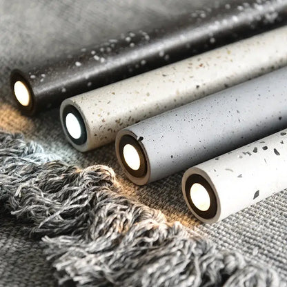 Concrete cylinder pendant lamps in black beige gray and white with speckled textures decorbites industrial stone led designs