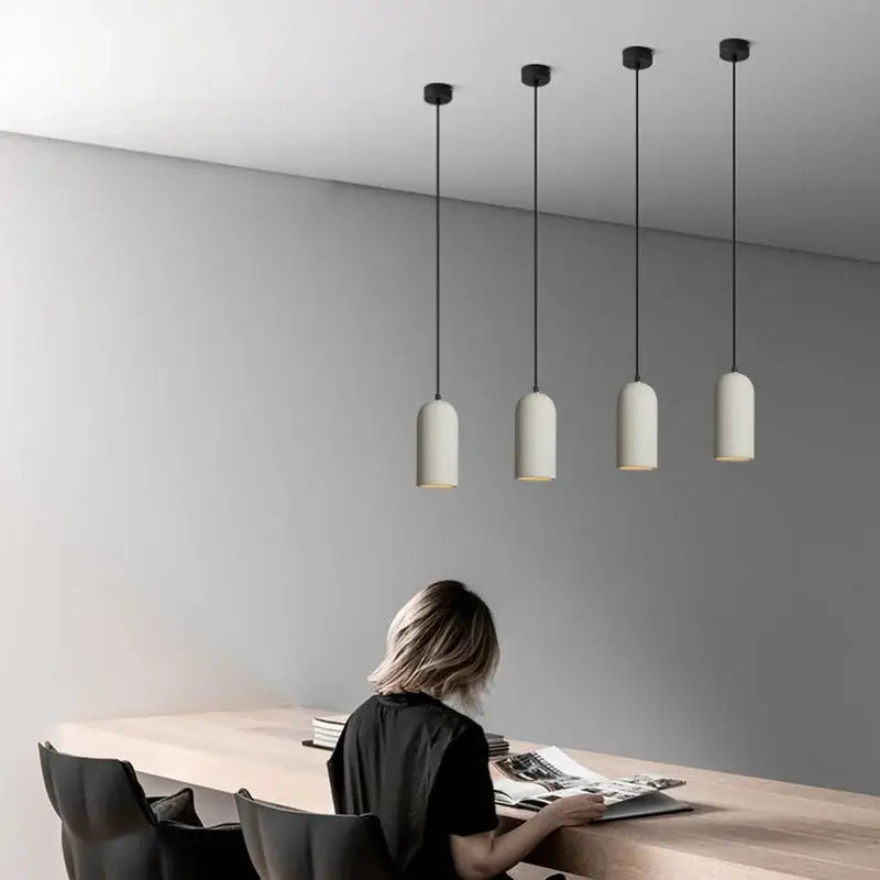 Four minimalist decorbites industrial style led pendant lights with matte off-white shades and black cords for bedroom decor