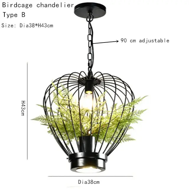 Black metal birdcage pendant lamp with adjustable chain and faux green ferns for industrial style planting decorbites decor