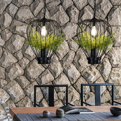 Black wrought iron pendant lamp with exposed bulbs and green ferns for decorbites industrial style planting decor