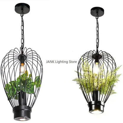 Black wrought iron industrial style planting pendant lamp with exposed bulbs and integrated plant holders for dining room decorbites industrial style