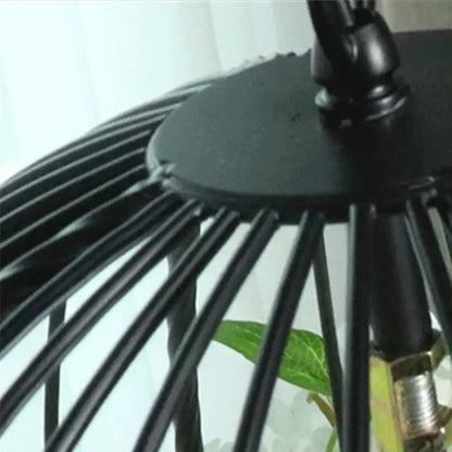 Black metal cage with slender vertical bars and circular top mount in decorbites industrial style rose chandelier pendant