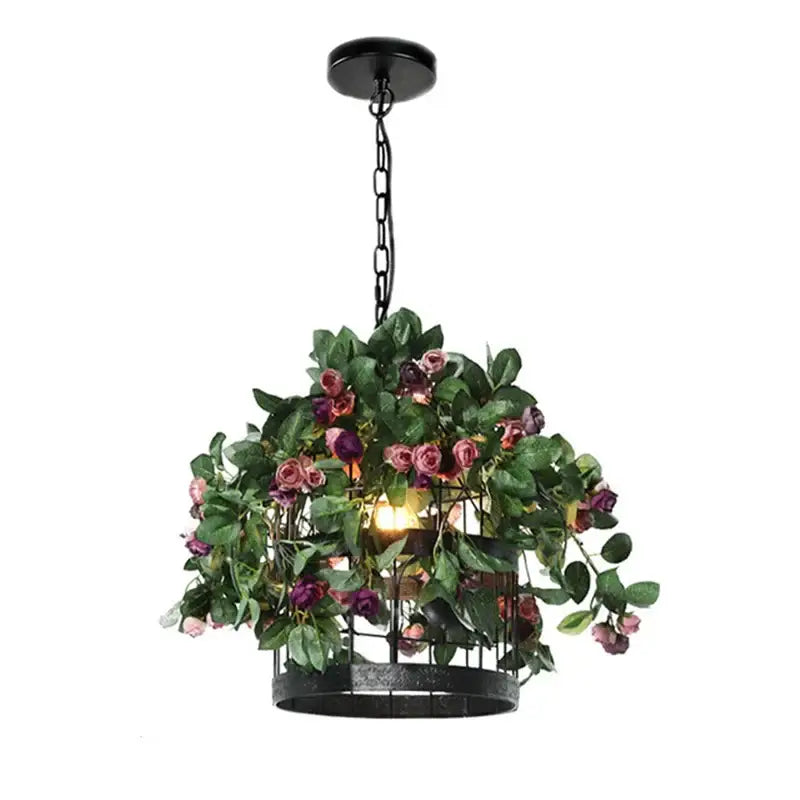 Black metal cage pendant light with lush green foliage and pink purple artificial roses decorbites industrial style rose chandelier