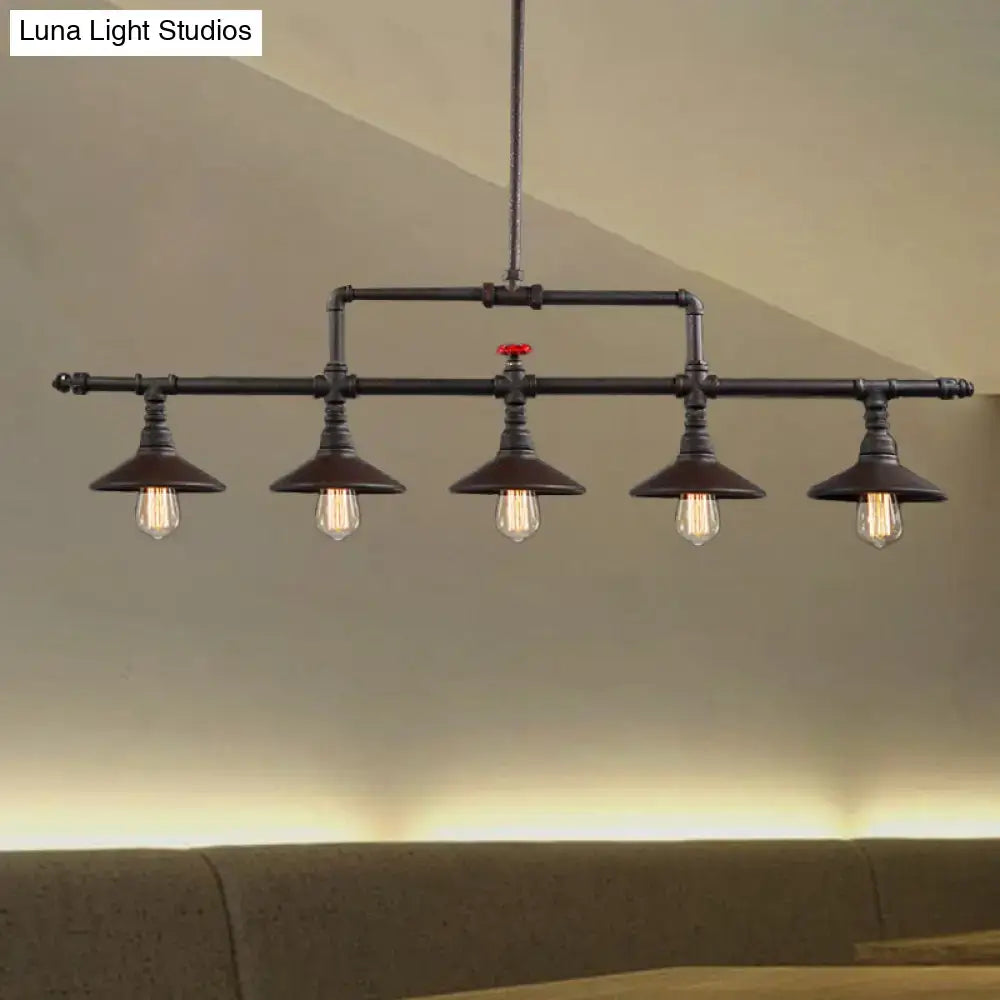 DecorBites™ industrial style black pipe chandelier with four exposed bulbs, cone shade, and red valve accent in rust finish