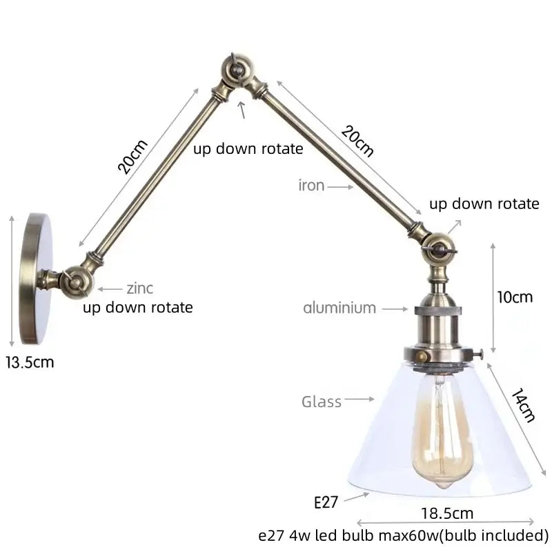 Adjustable industrial swing arm loft lamp with brass-finished zinc aluminum arm and clear glass shade over led bulb