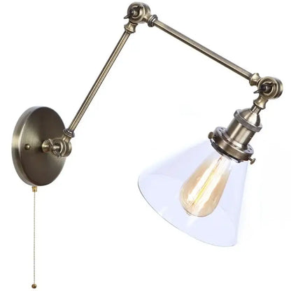 Antique brass industrial swing arm bedroom sconce with clear glass shade and exposed Edison bulb loft lamp