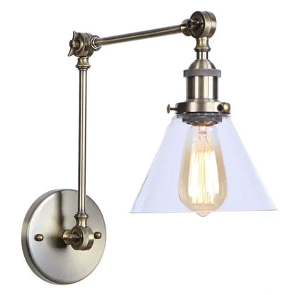 Antique brass industrial swing arm wall sconce with clear glass conical shade and exposed edison bulb for bedroom decorbites industrial swing