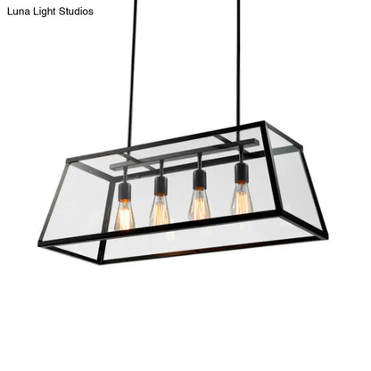 Black framed industrial trapezoid island lamp with clear glass panels and four exposed filament bulbs by decorbites