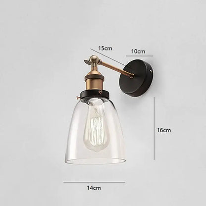 Industrial vintage black and brass wall sconce with clear glass shade and exposed edison bulb for decorbites industrial vintage loft decor