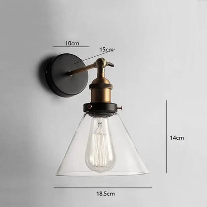 Industrial vintage black and brass wall sconce with glass shade featuring exposed filament bulb for decorbites industrial vintage loft decor