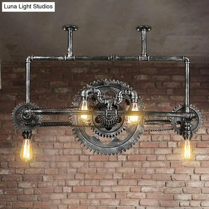 Industrial vintage black gear chandelier with dark metallic finish and exposed edison bulbs for dining room lighting