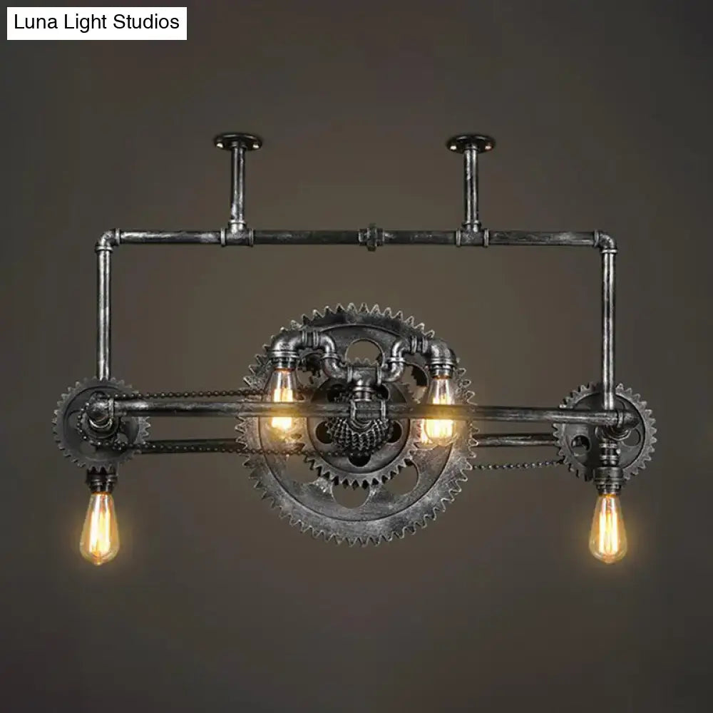 Industrial vintage black gear chandelier with dark metallic pipes and exposed filament edison bulbs for dining room lighting