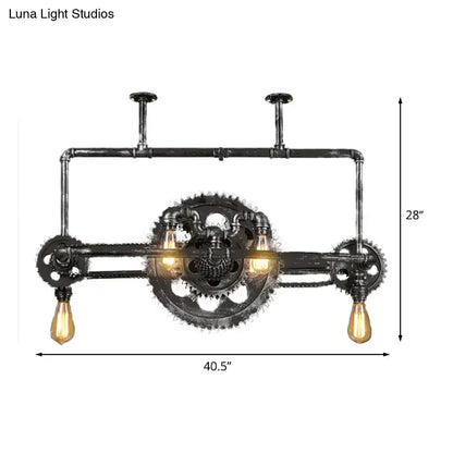 Industrial vintage black gear chandelier featuring black pipe with three exposed edison filament bulbs for dining room