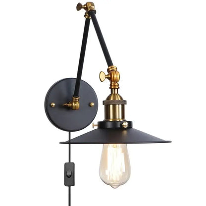 Industrial vintage black iron wall light with adjustable long arm black metal shade brass accents and exposed edison bulb decorbites black iron wall light