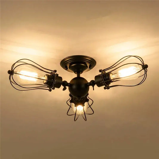 Industrial vintage black metal cage ceiling light with three exposed filament bulbs for dining room decorbites industrial vintage