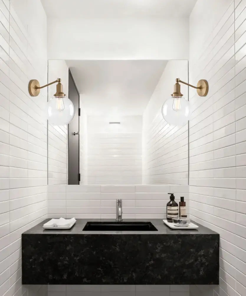 Black marble sink with sleek rectangular design and modern chrome faucet complement decorbites industrial vintage wall sconce