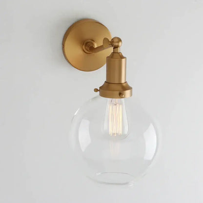Gold-finished decorbites industrial vintage wall sconce with clear glass globe and exposed filament bulb for bedroom decor