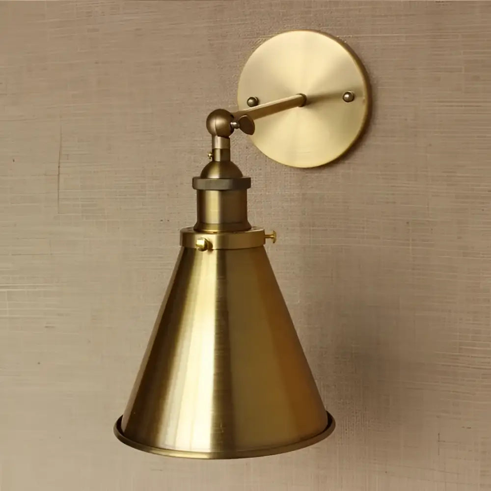 Industrial vintage brass wall sconce with adjustable arm and conical shade for bedroom decorbites industrial vintage lighting