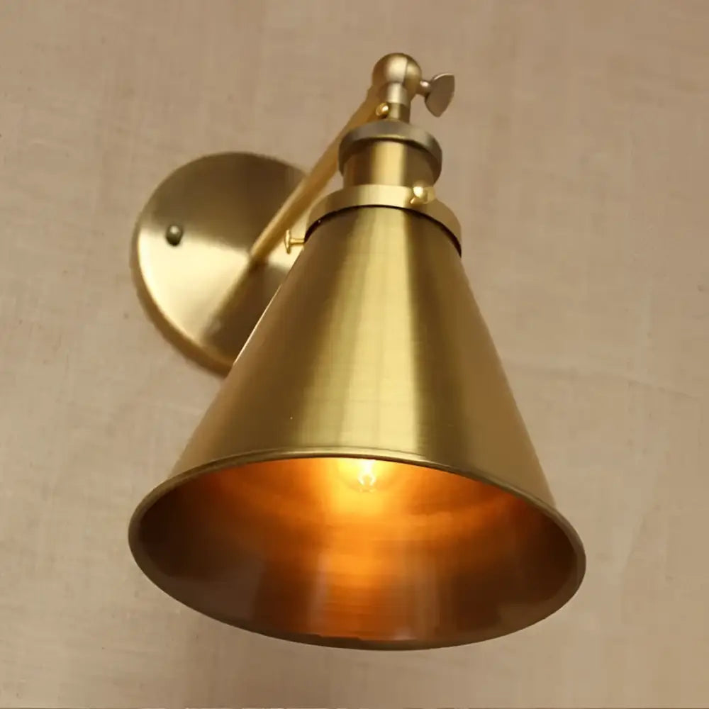 Brass conical industrial vintage brass wall sconce with adjustable arm and warm glowing light for bedroom decorbites decor