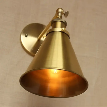 Brass conical industrial vintage brass wall sconce with adjustable arm and warm glowing light for bedroom decorbites decor