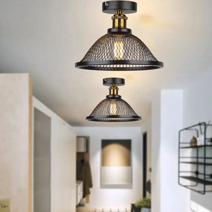 Industrial vintage cage ceiling light with black mesh and brass accents providing warm kitchen decorbites industrial vintage glow