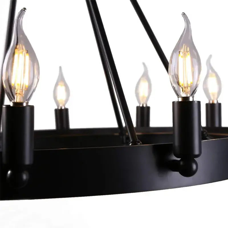 Black wrought iron 8 light industrial vintage chandelier with clear flame-shaped bulbs by decorbites industrial vintage