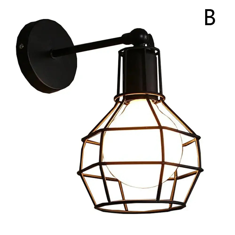Black metal wall light with geometric cage design featuring an industrial vintage led orange leather bedroom sconce