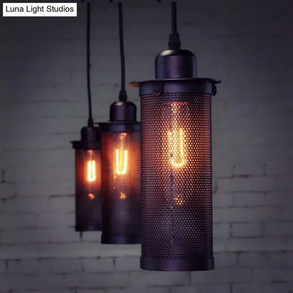 Industrial vintage metal pendant light with dark metal mesh cylinder and exposed filament bulb for kitchen use