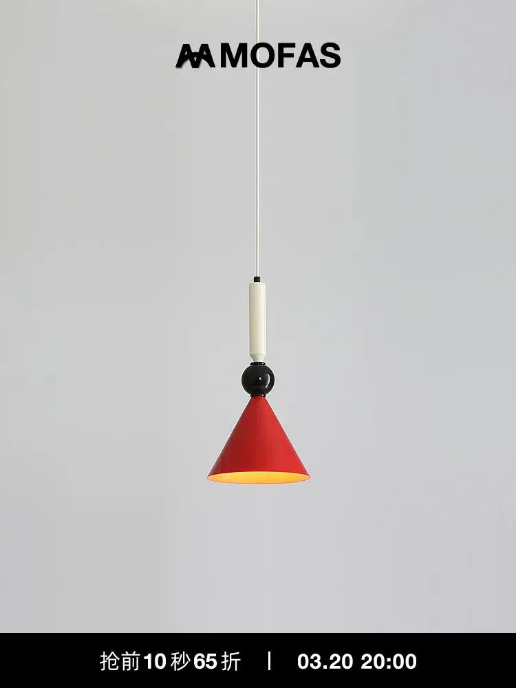 A sleek red conical industrial vintage pendant light with black accent and white cord by mofas for kitchen decorbites