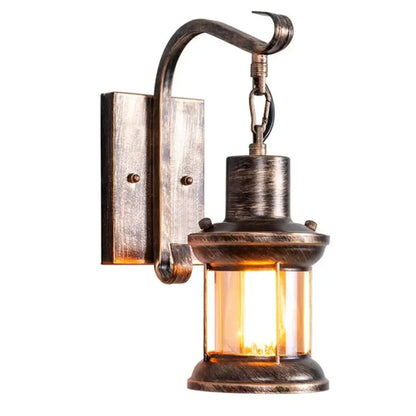 Antique bronze wall light with clear glass panels and warm glow from decorbites industrial vintage wall sconce fixture