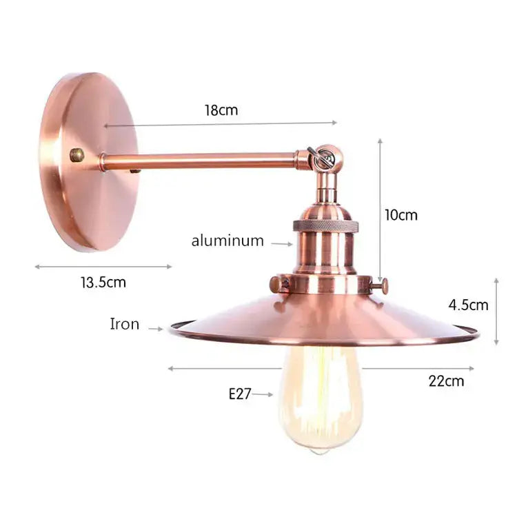 Copper-finished industrial vintage wall sconce with brass iron base and aluminum arm featuring exposed edison bulb for bedroom decorbites industrial vintage design
