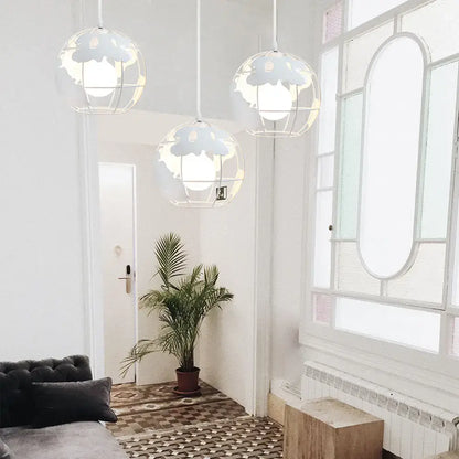 Three white metal pendant lights with cloud-shaped cutouts from decorbites industrial vintage loft kitchen globe decor