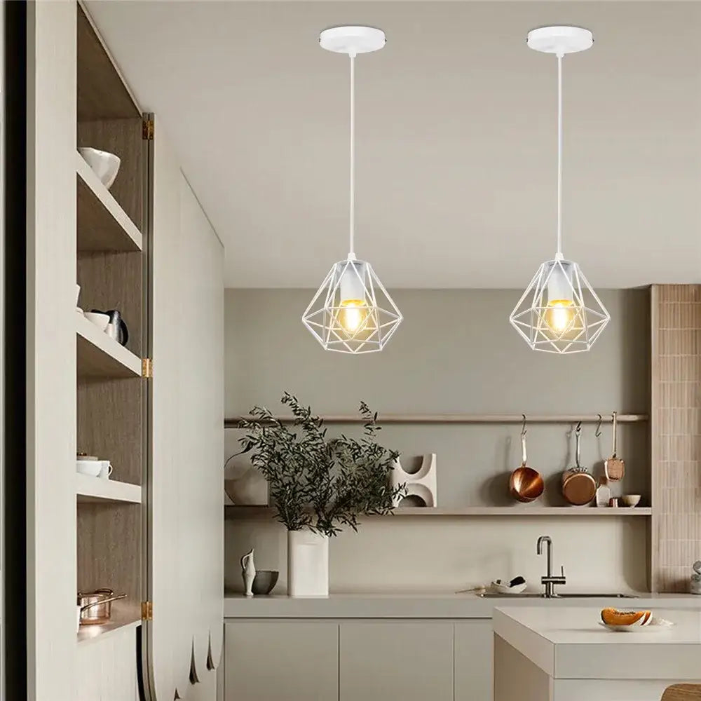 Two white wrought cage pendant lights with geometric wireframe design hang from ceiling for living room decorbites industrial vintage style