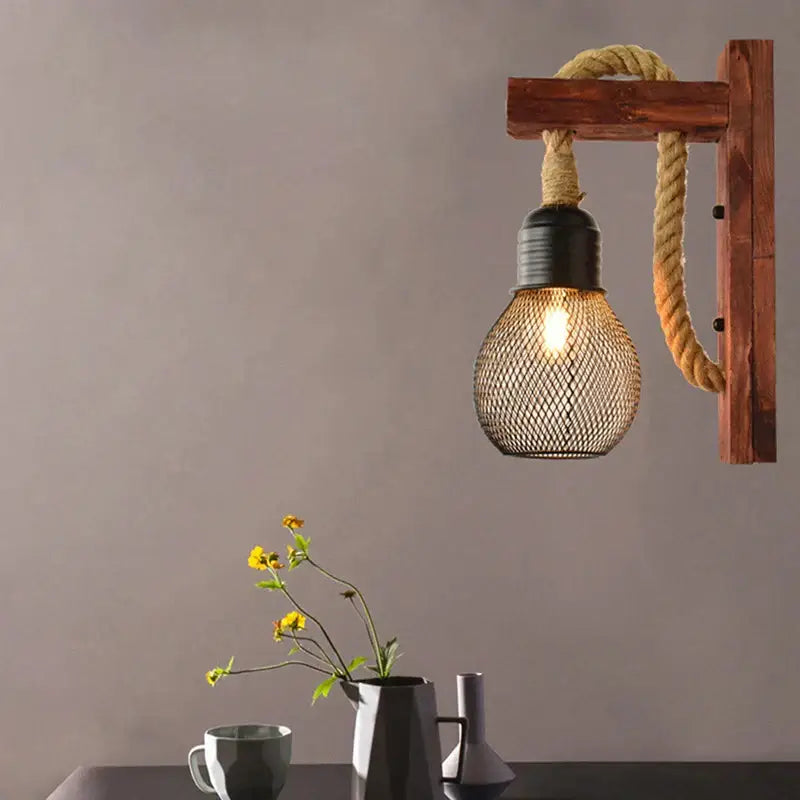 Rustic wooden wall lamp with black metal mesh bulb and thick beige rope decorbites industrial vintage sconce for bedroom