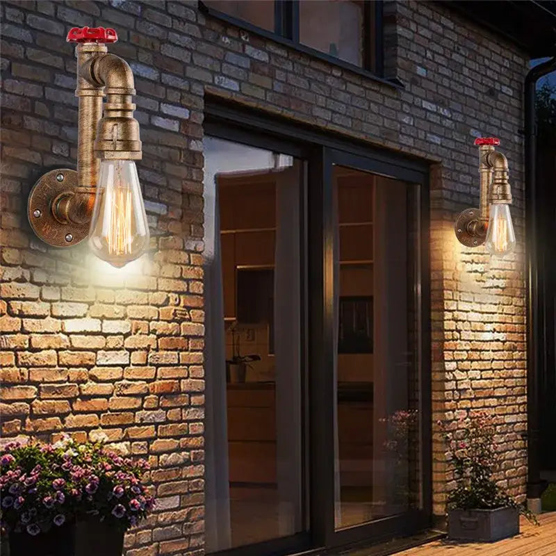 Industrial water pipe wall sconce with brass pipe and red valve accents featuring clear edison bulb for corridor decorbites industrial water
