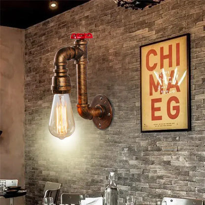 Industrial water pipe wall sconce with brass pipe, red valve, and exposed Edison bulb for corridor decorbites industrial water