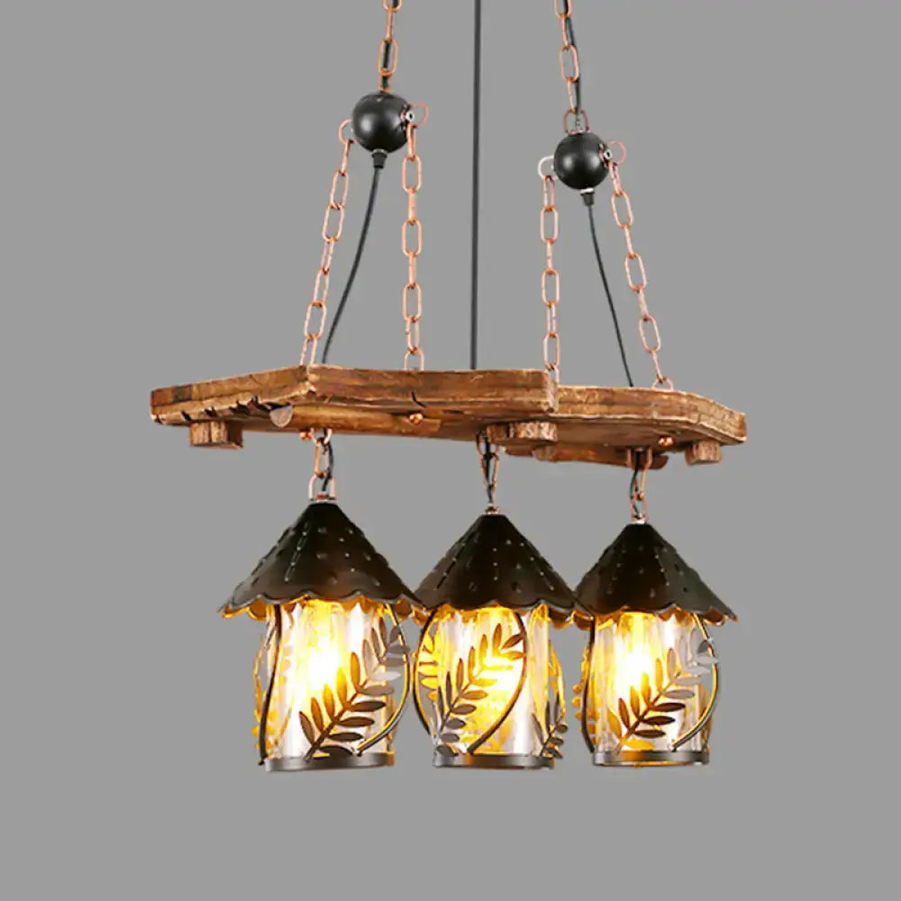 Rustic wooden plank chandelier with three black metal leaf-patterned glass lanterns for industrial white clear lantern island lighting