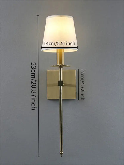 Brass-finished wall lamp with cylindrical stem and off-white fabric shade from decorbites industrial white wall collection