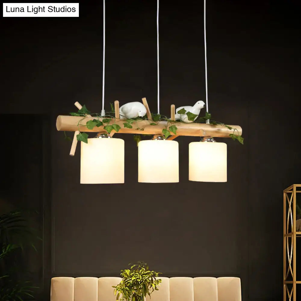 Natural wood branch pendant light with three cream milky glass cylinders and white bird accents for coffee shop 220v-240v