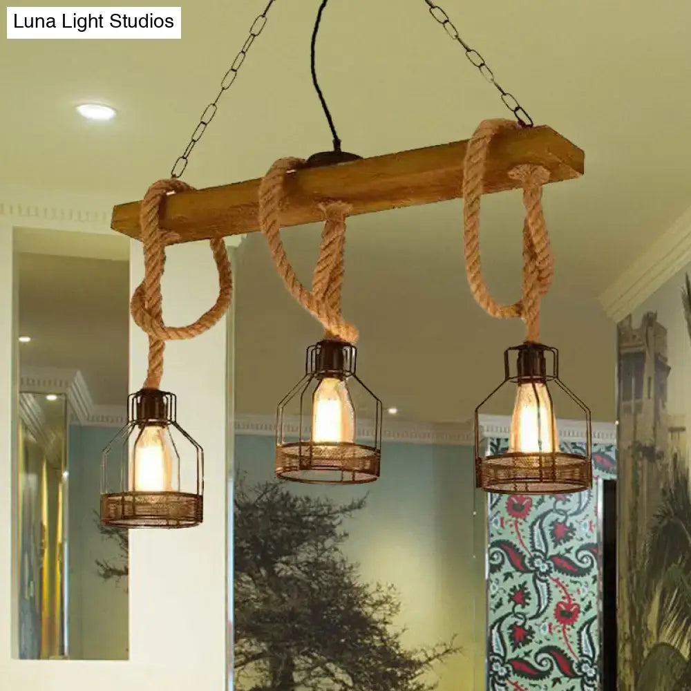 Rustic wooden beam black pendant chandelier with three industrial wire cage lights and thick rope for restaurant island lighting