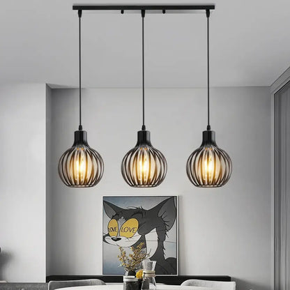 Black metal industrial wood pendant light with vertical wire cage design and warm glowing bulbs for dining room decorbites industrial wood