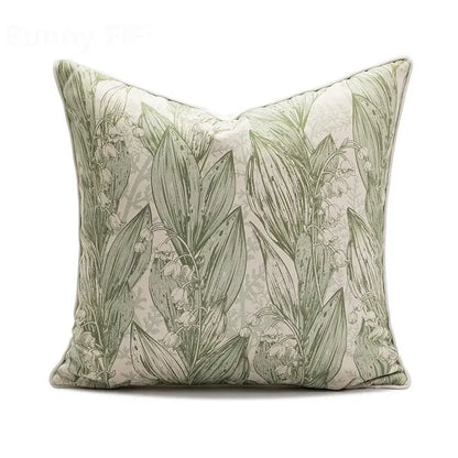 Square ins wind matcha green faux fur throw pillow with delicate lily-of-the-valley botanical print on off-white background
