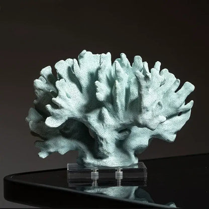 A light teal textured coral resin ornament with a porous branching structure for living room decor