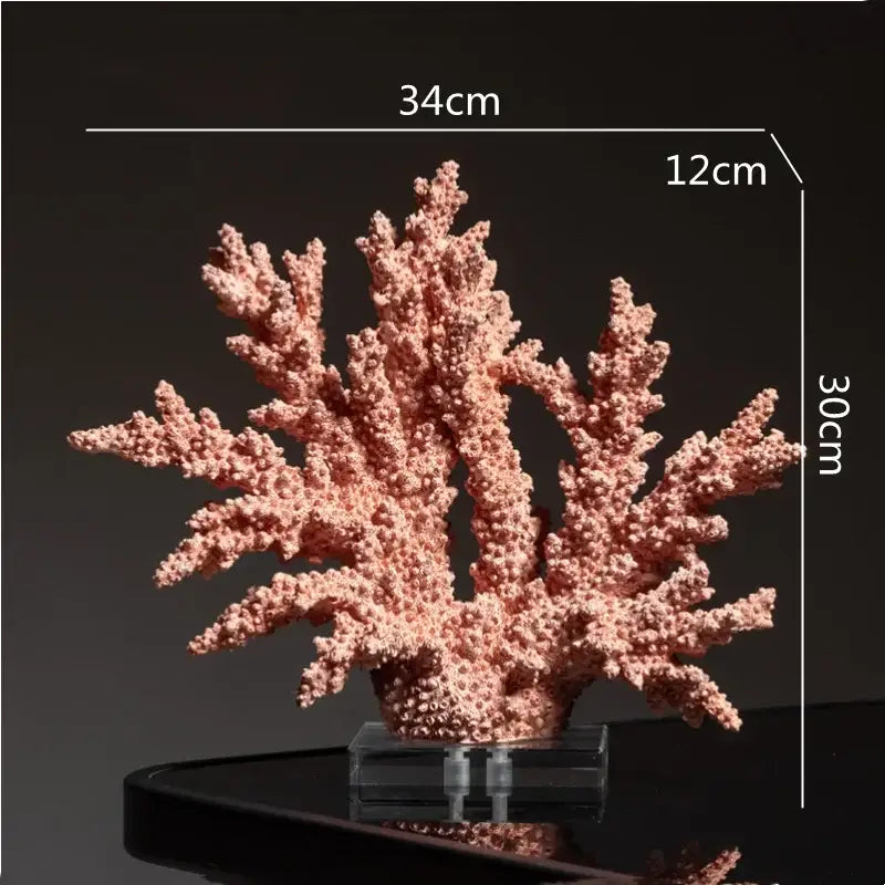 Intricate pink coral resin ornaments with glossy branching details displayed on a clear acrylic stand for living room decor
